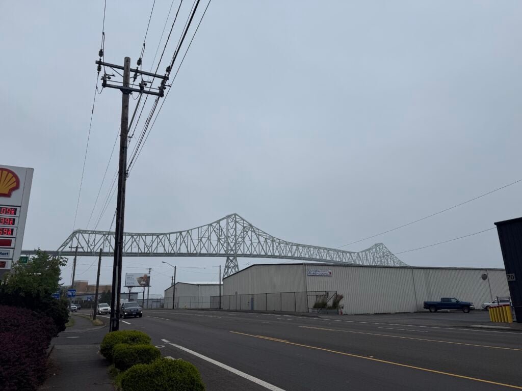 bridge in the distance behind road