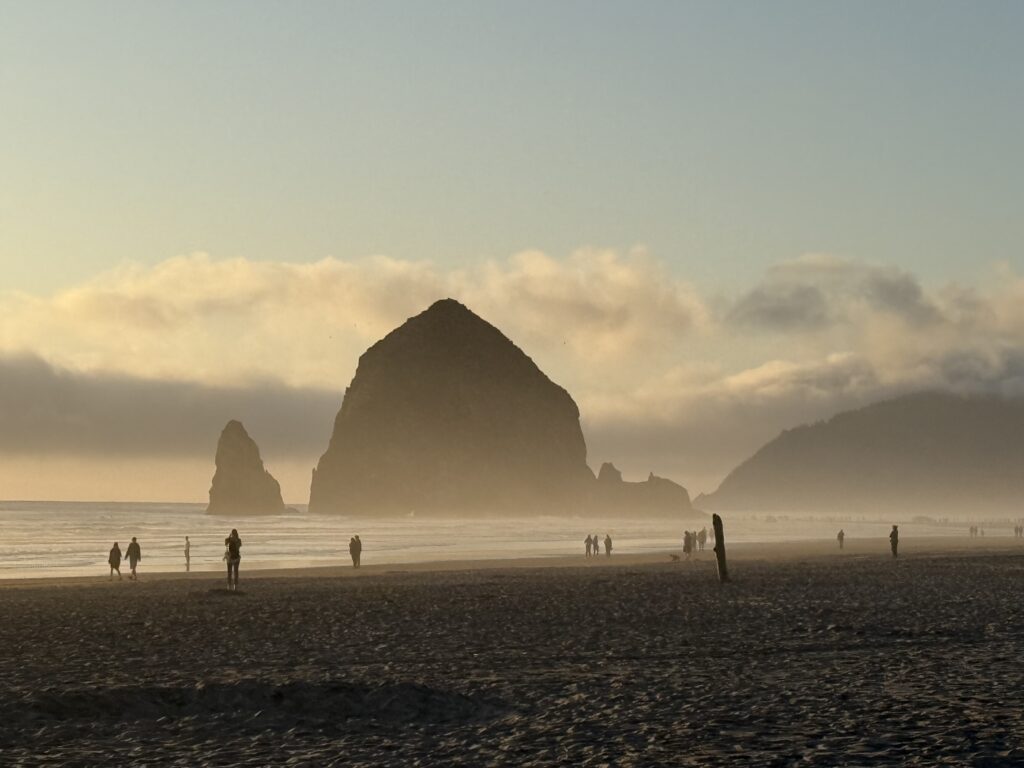 sea stacks on beach at sunset
