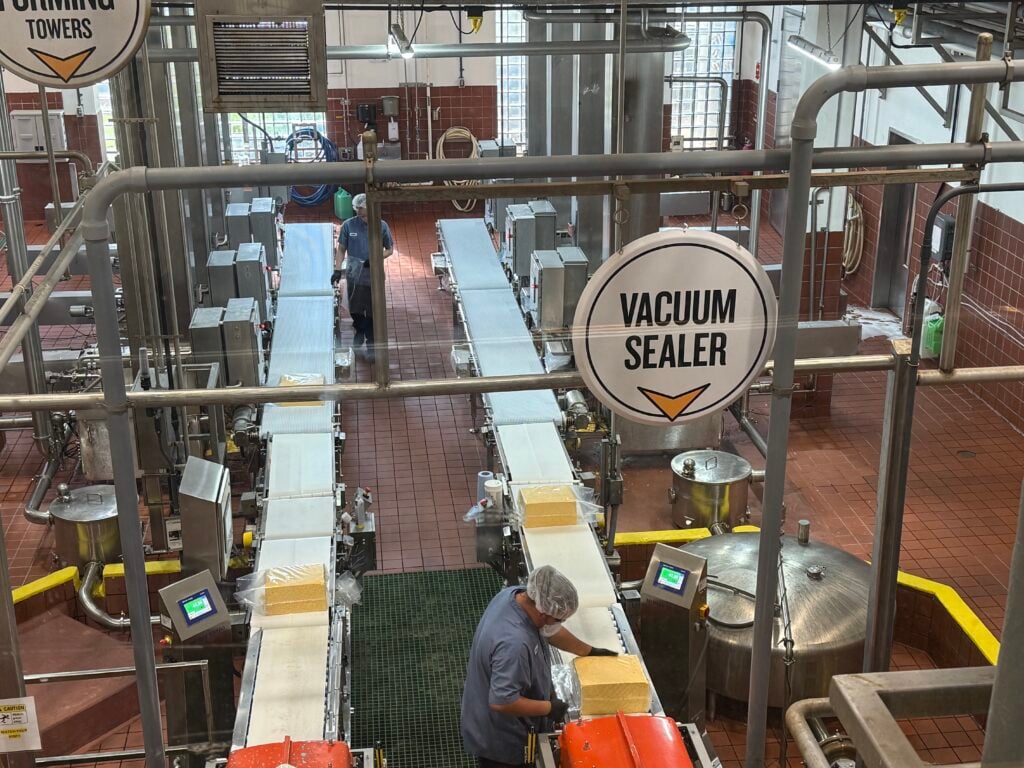 people working in cheese factory