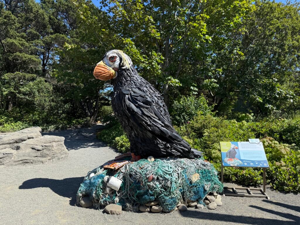 puffin statue made of trash