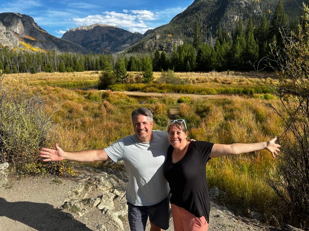 man and woman in valley near Grand Lake