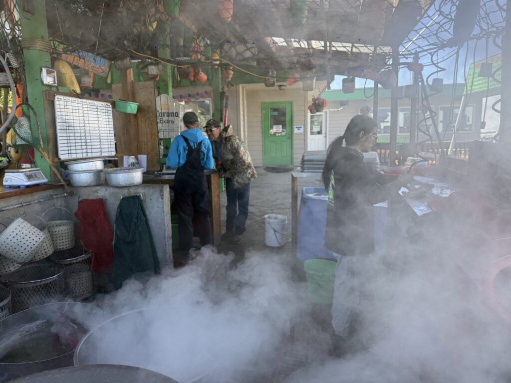 steaming pot with people working in background