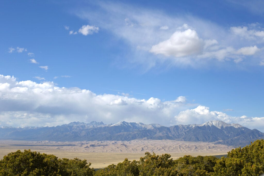 View of mountain from sand dunes