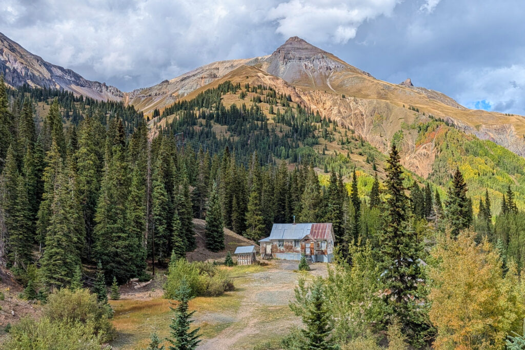 old mining building in the woods in the distance