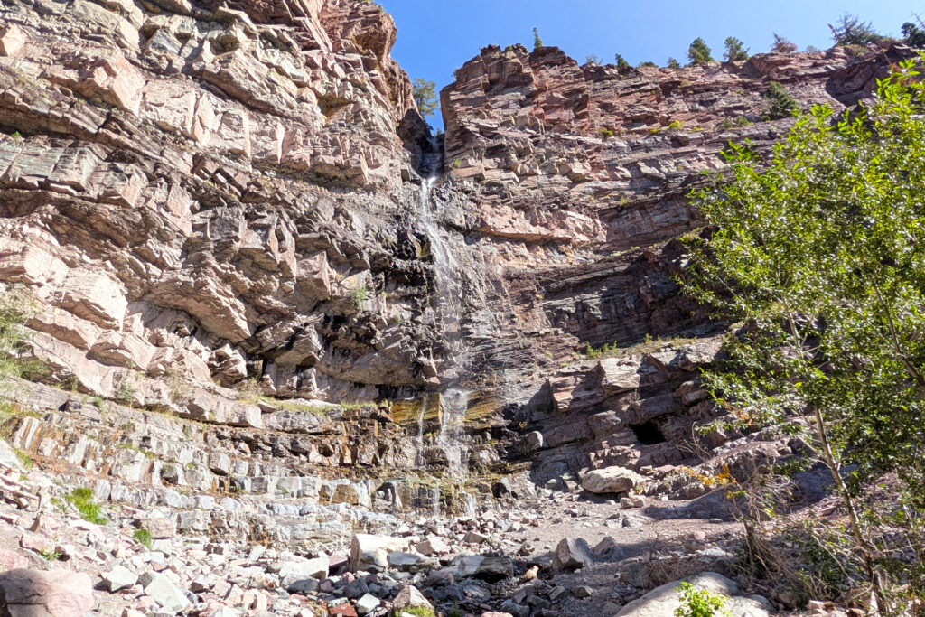 waterfall down rocky cliff