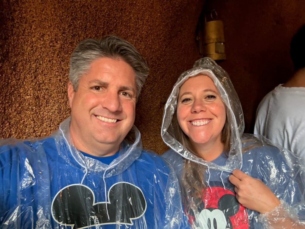 Man and woman wearing ponchos