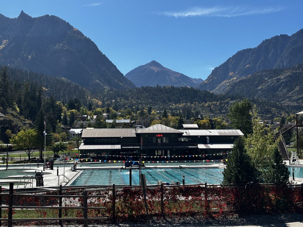 hot springs pools and building behind gate