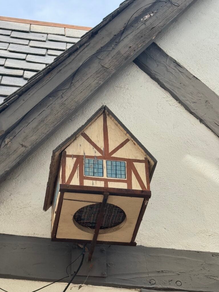Elf house on side of building