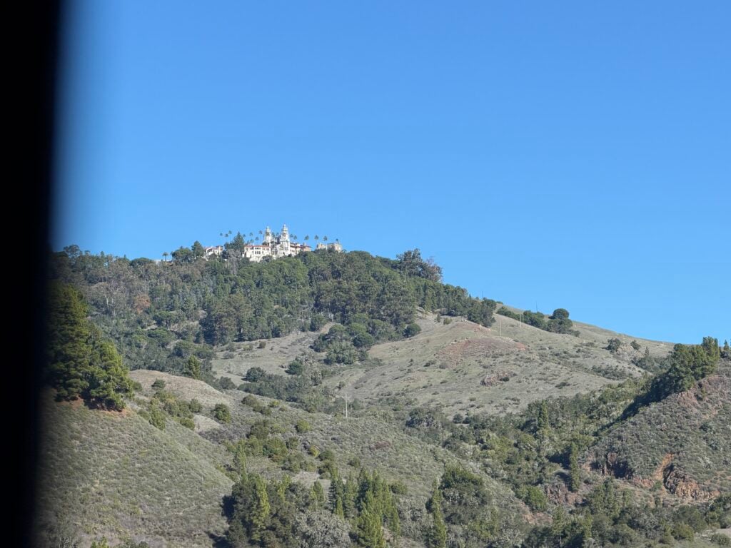 View of Hearst Castle in distance on hill
