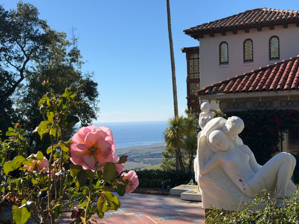 statue of people in front of house