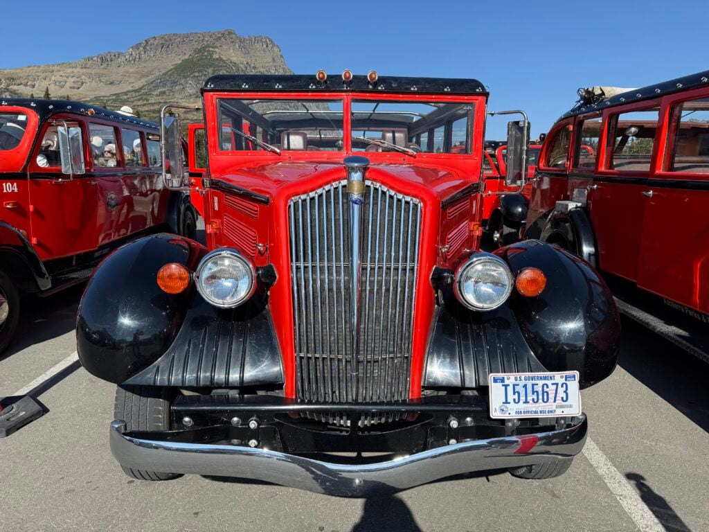 front view of red bus in Glacier national park