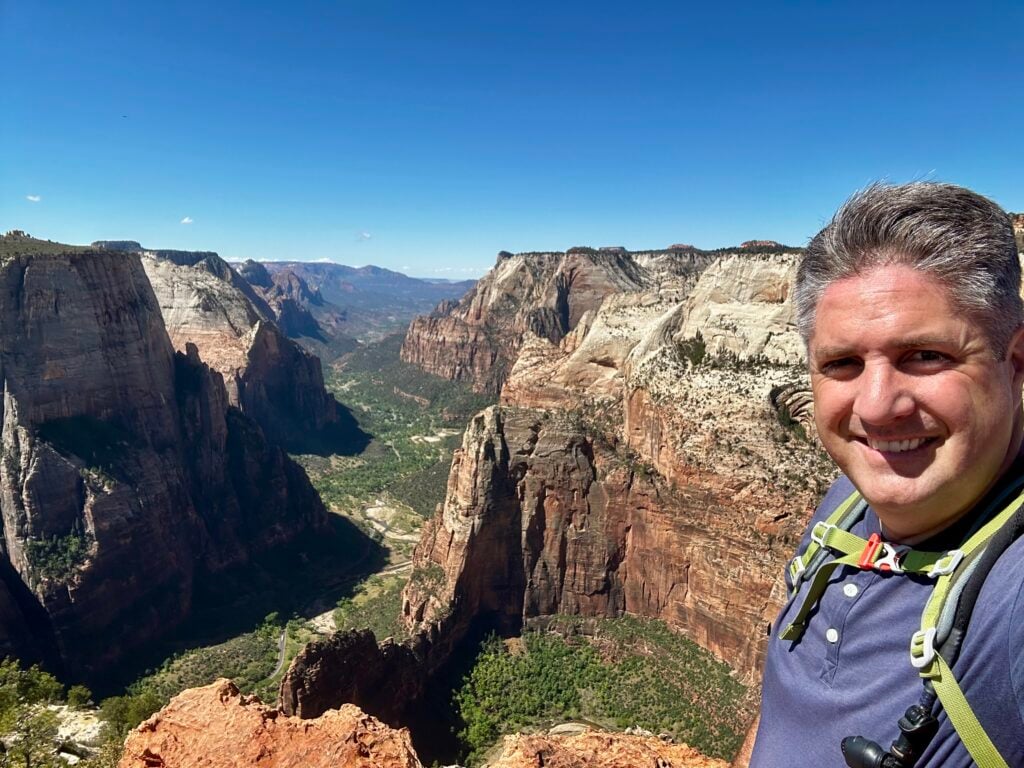 man at viewpoint above canyon