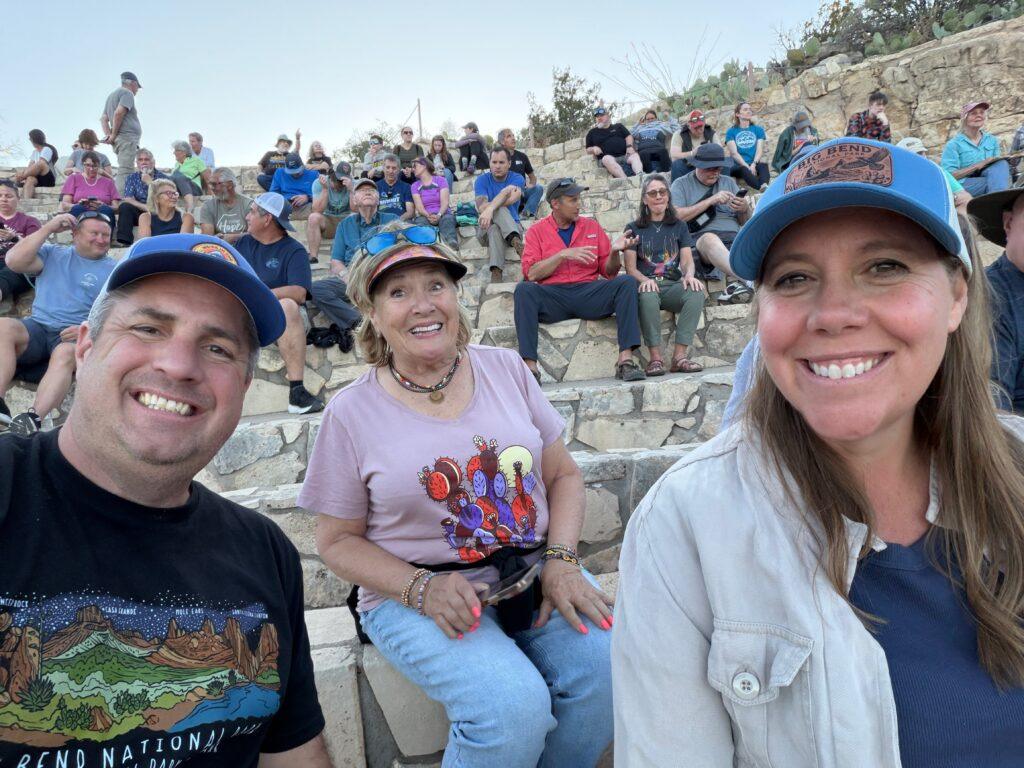 people taking selfie in amphitheater