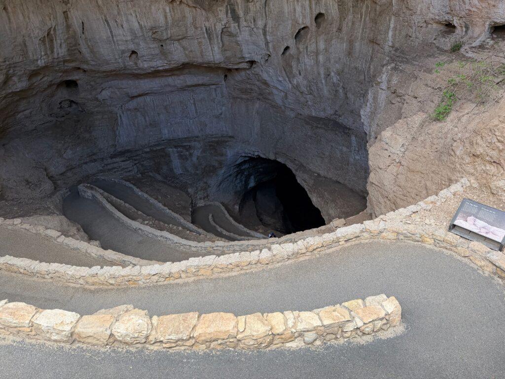 paved walkway down into cave