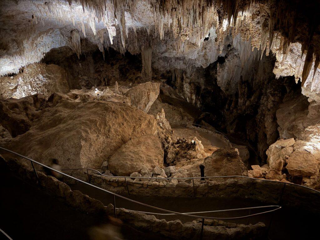 pathway with railing down into cave