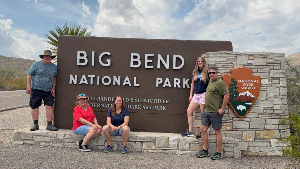 family standing in front of Big Bend National Park sign