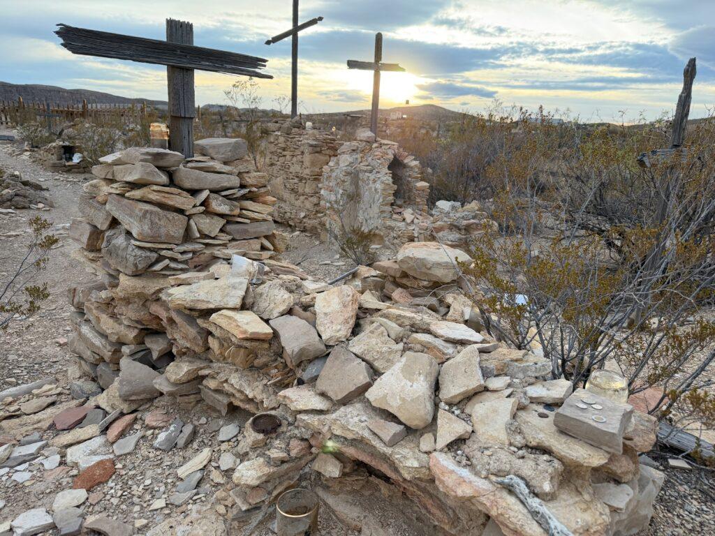 old cemetery with wooden crosses and flat rocks