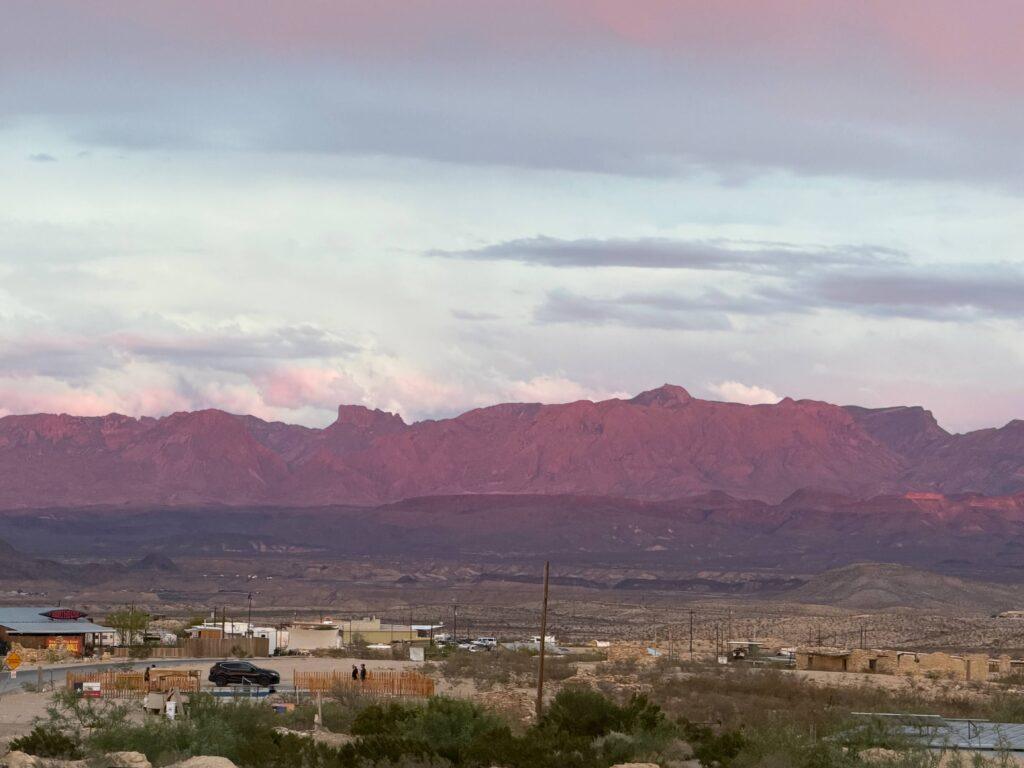 view of mountains in desert at sunset