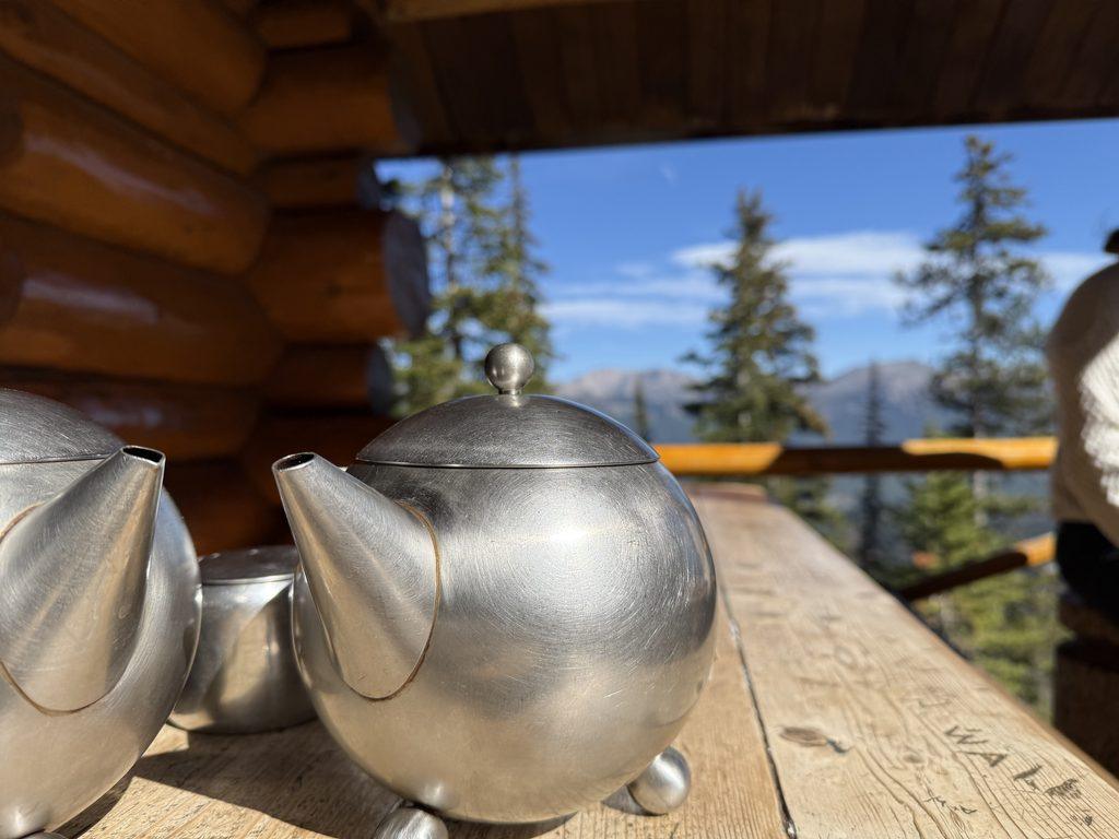 silver teapots on table