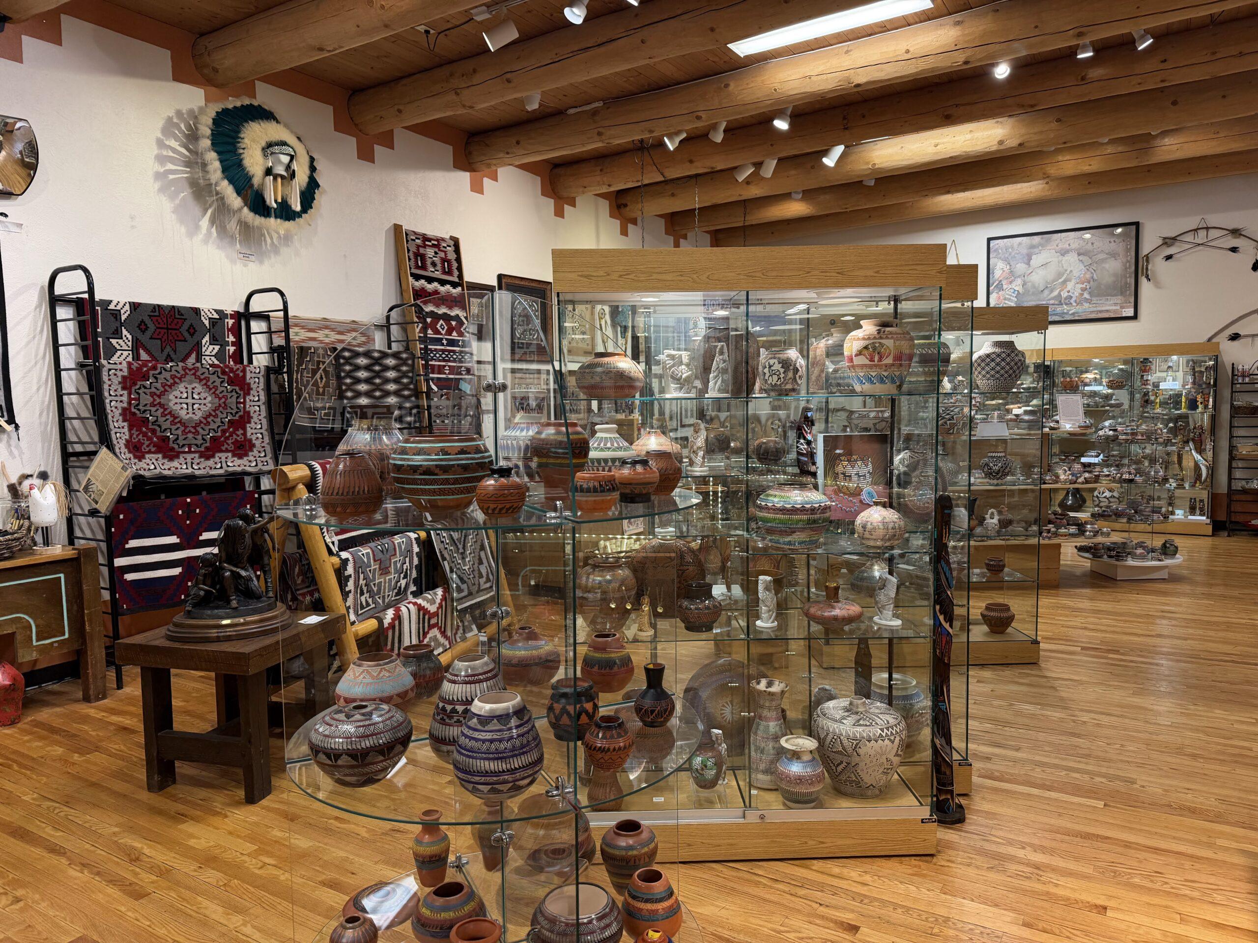 Pottery, rugs, and art displayed inside the Garden of the Gods Trading Post