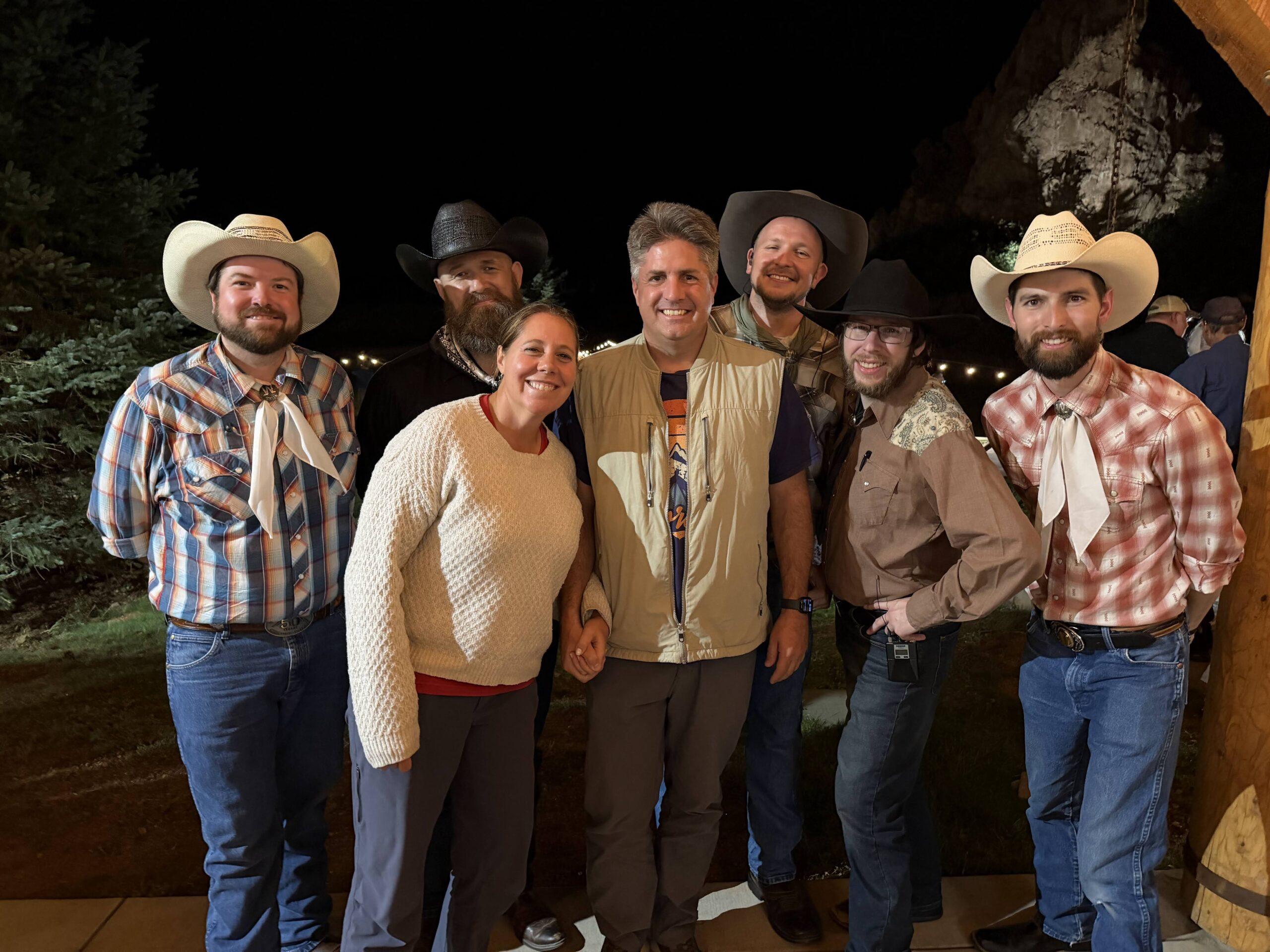 Cheryl and Matt posing with the Flying W Wranglers after the evening show
