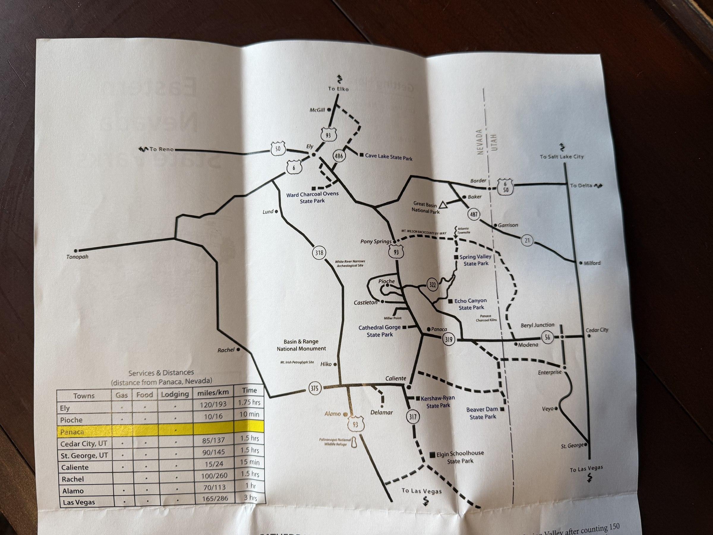 Photographed brochure map showing state parks and connecting roads in eastern Nevada.